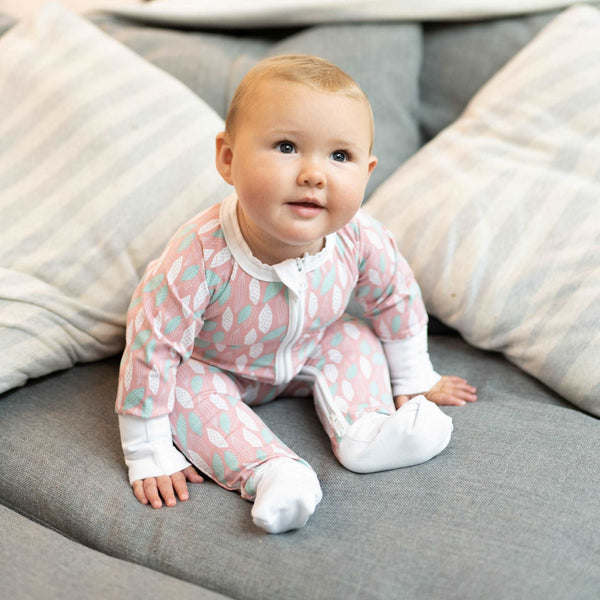 The Pink Leaves ZippySuit. The perfect baby grow has a 2-way zip for quick and easy changes, foldable mitts and foldable feet pouches.